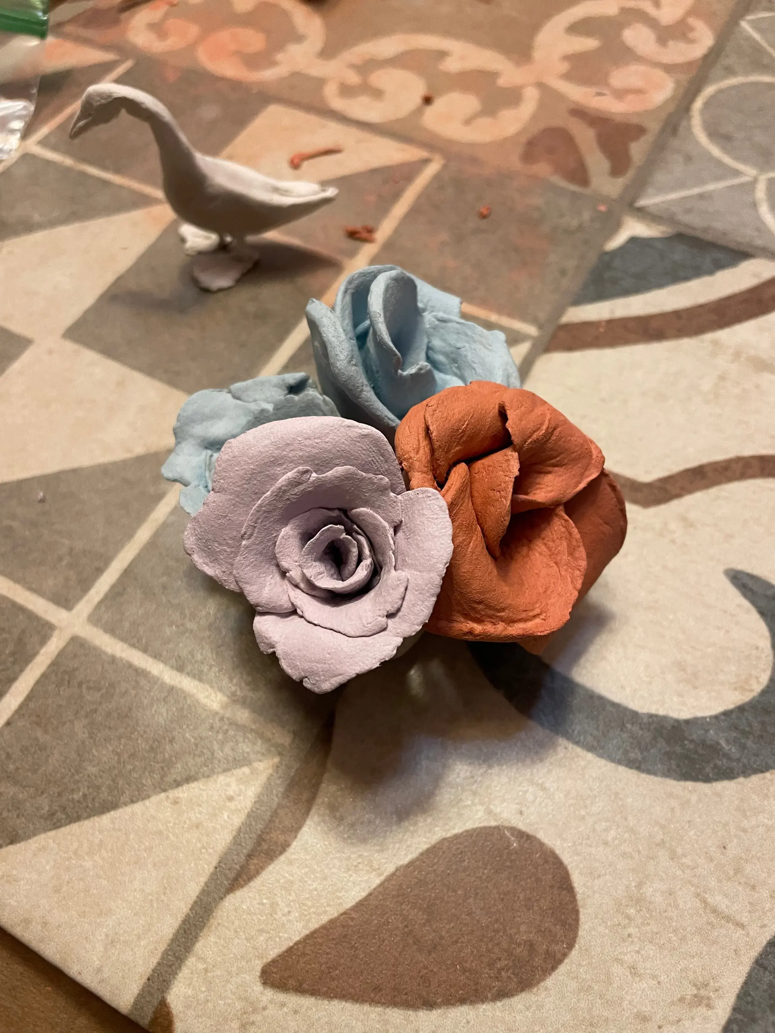 A photo of handmade clay flowers in a bouquet.